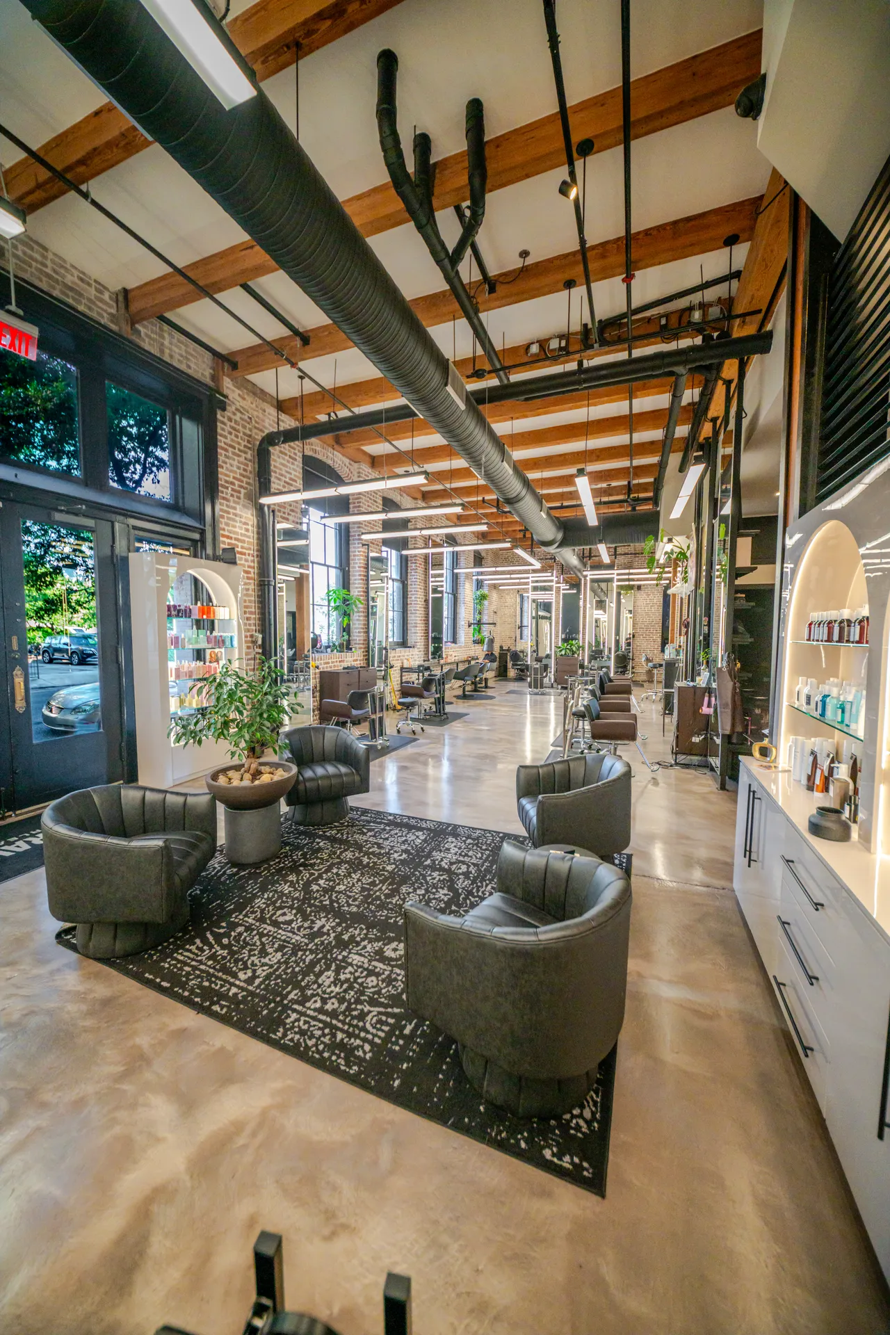Bronze metallic epoxy floor in a salon with an exposed wood beam ceiling