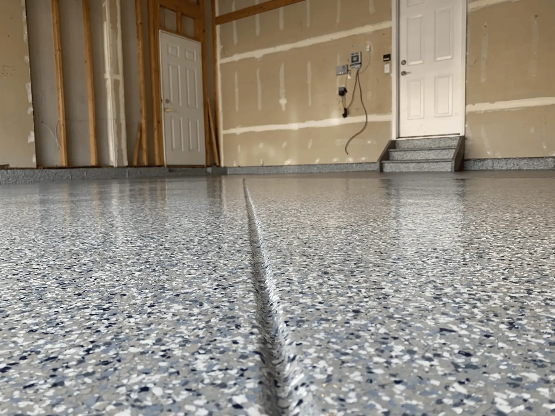 Clean gray epoxy coated residential garage floor